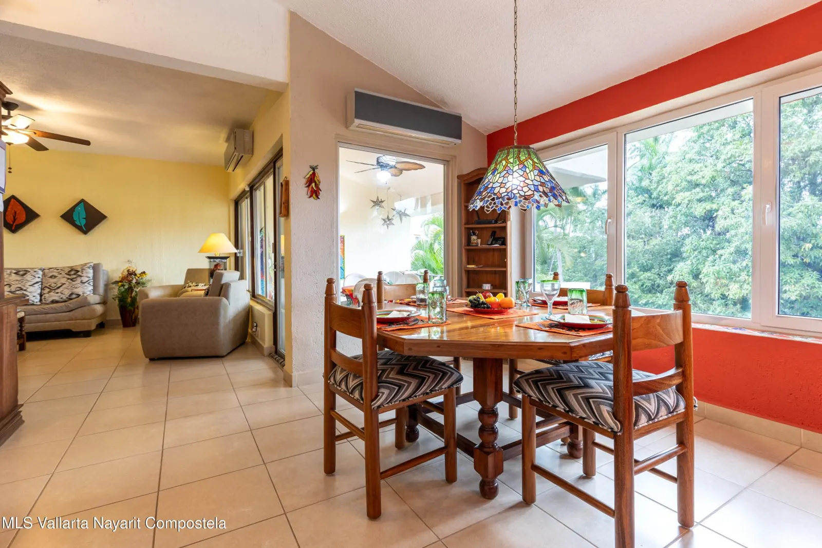 Living room of the Bugambilias penthouse in Nuevo Vallarta, with a sofa and a terrace