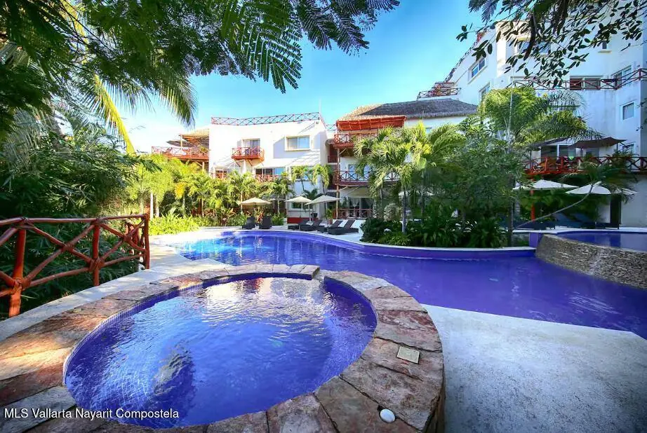 Pool with hot tub and garden