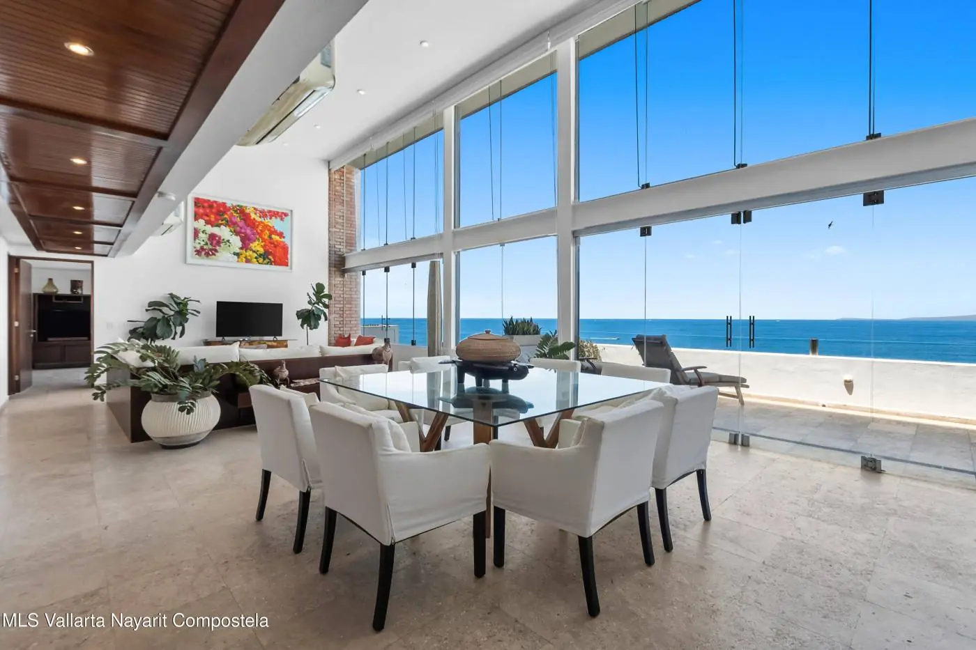 Living room with floor-to-ceiling windows and ocean view at Santa Barbara Shores
