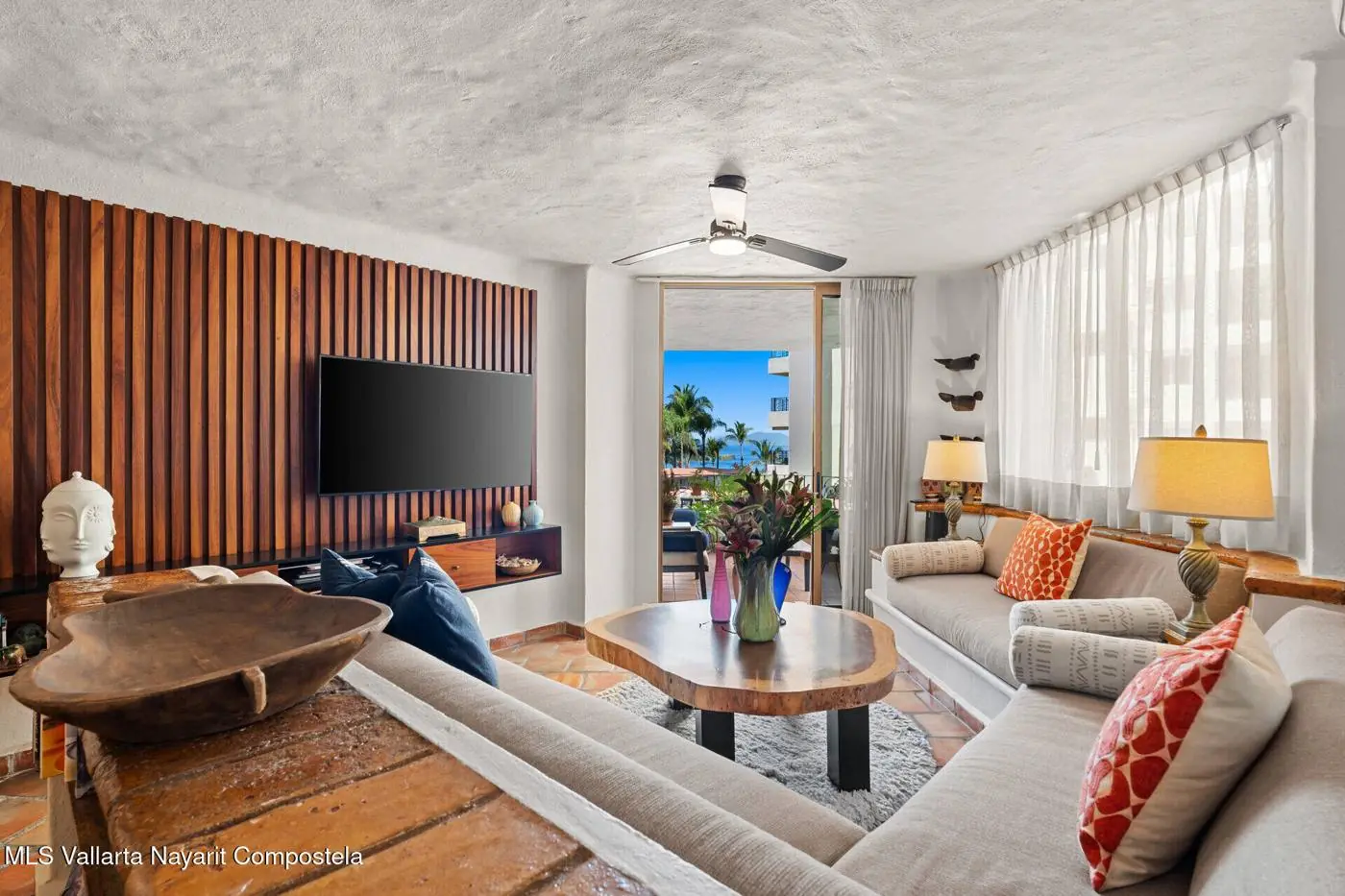 Living room with handcrafted decor and bay view