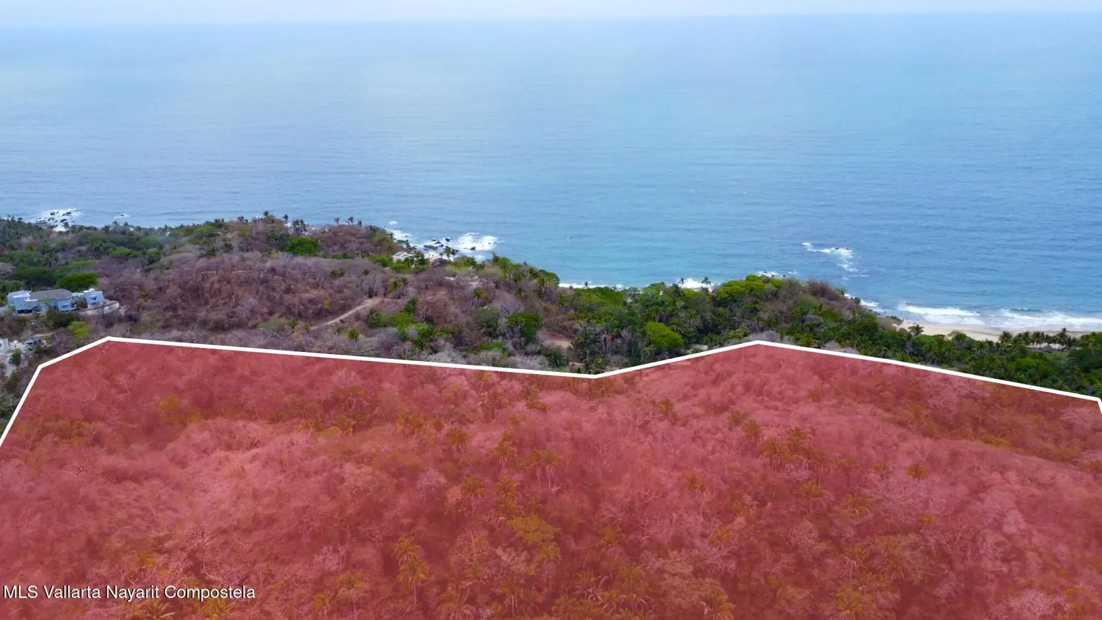 Aerial view of a sandy point and the sea, included with the listing for the lot south of Sayulita.