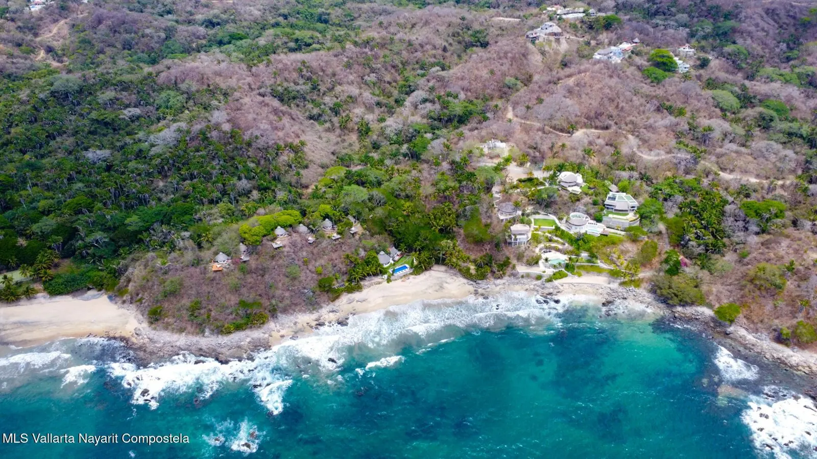 Cobblestone road through palms and dry grass, in the photos of the lot south of Sayulita.