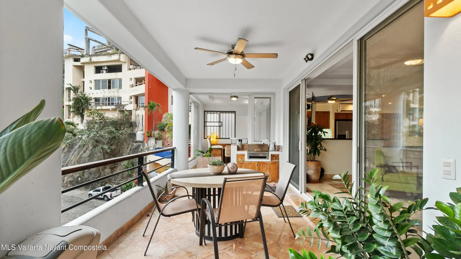 Covered terrace of Nadeo A1, with a dining table