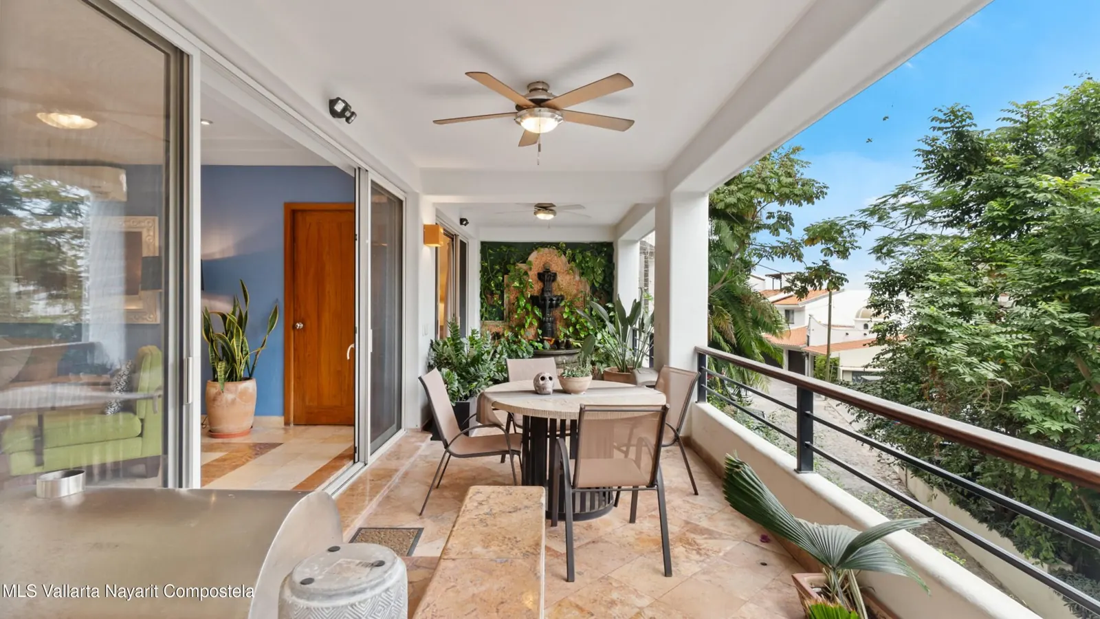 Living and dining area of Nadeo A1 in Amapas, with a sofa, a dining table, and a terrace